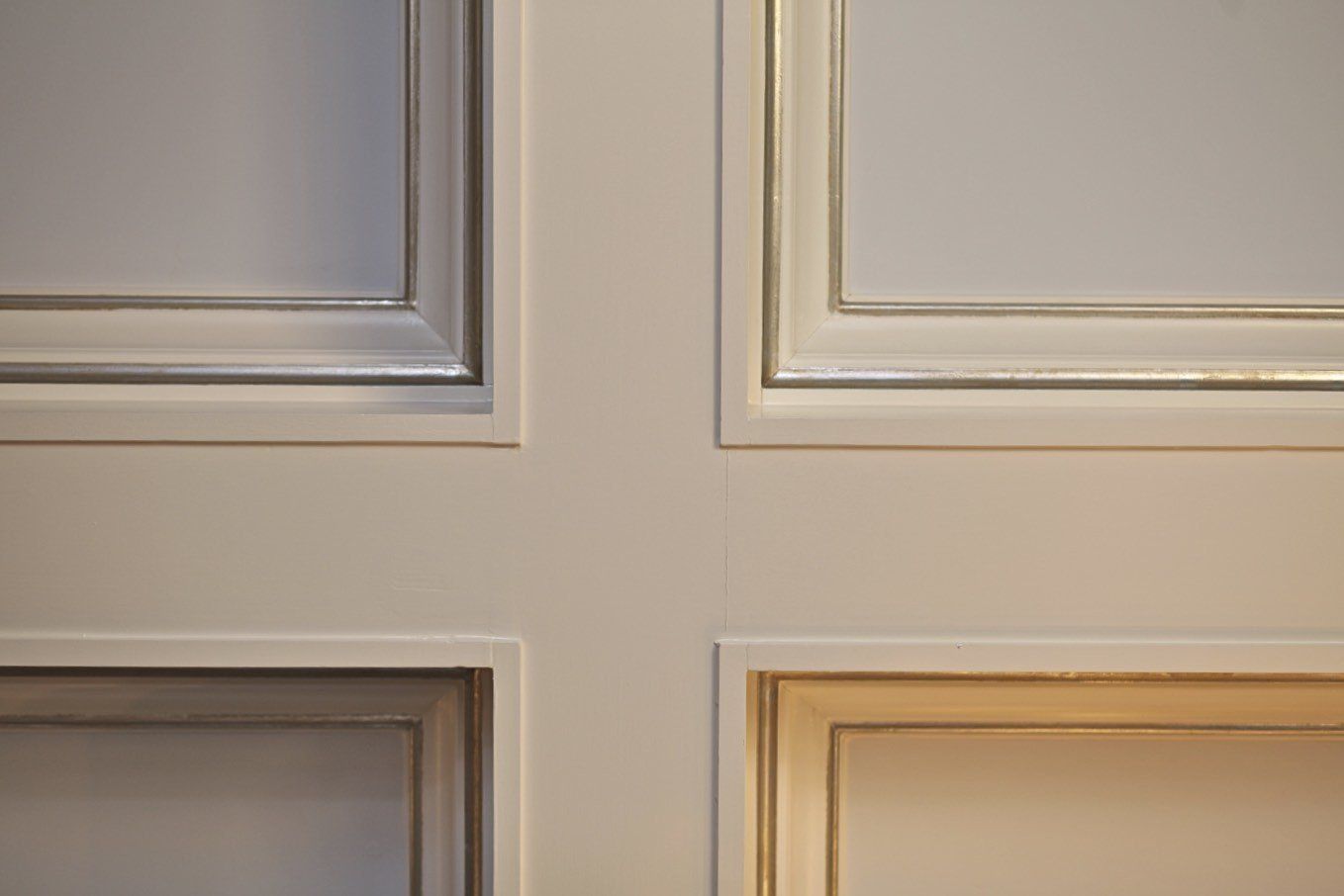 A close up of four different types of cabinet doors.