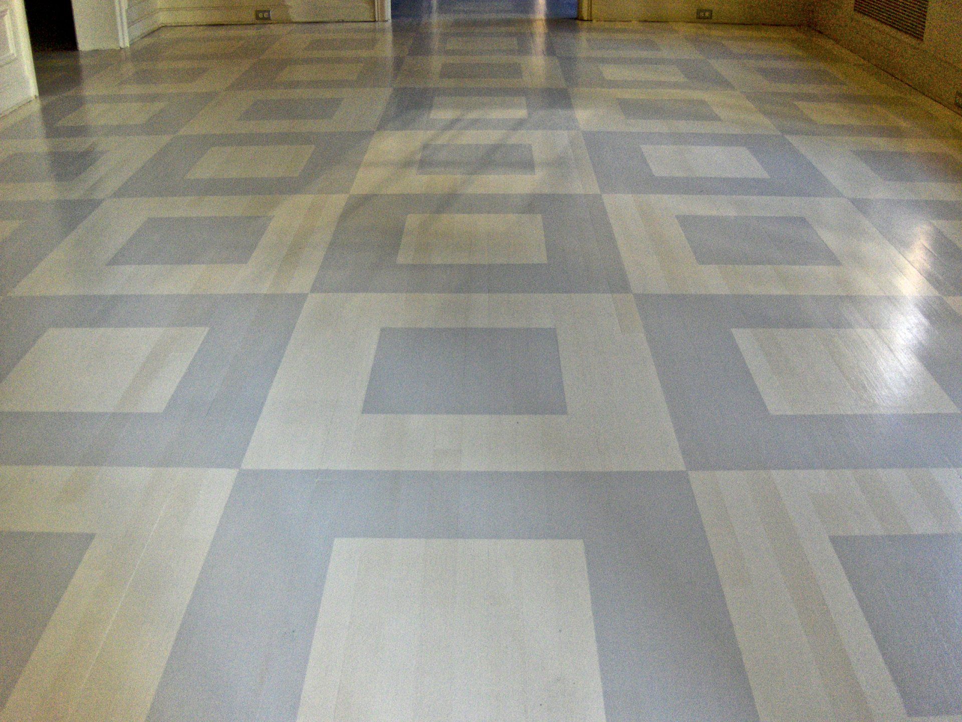 A tiled floor with a pattern of squares on it