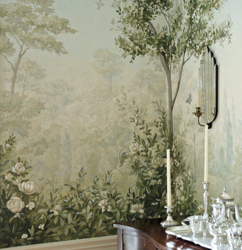 A room with a painting of trees and flowers on the wall