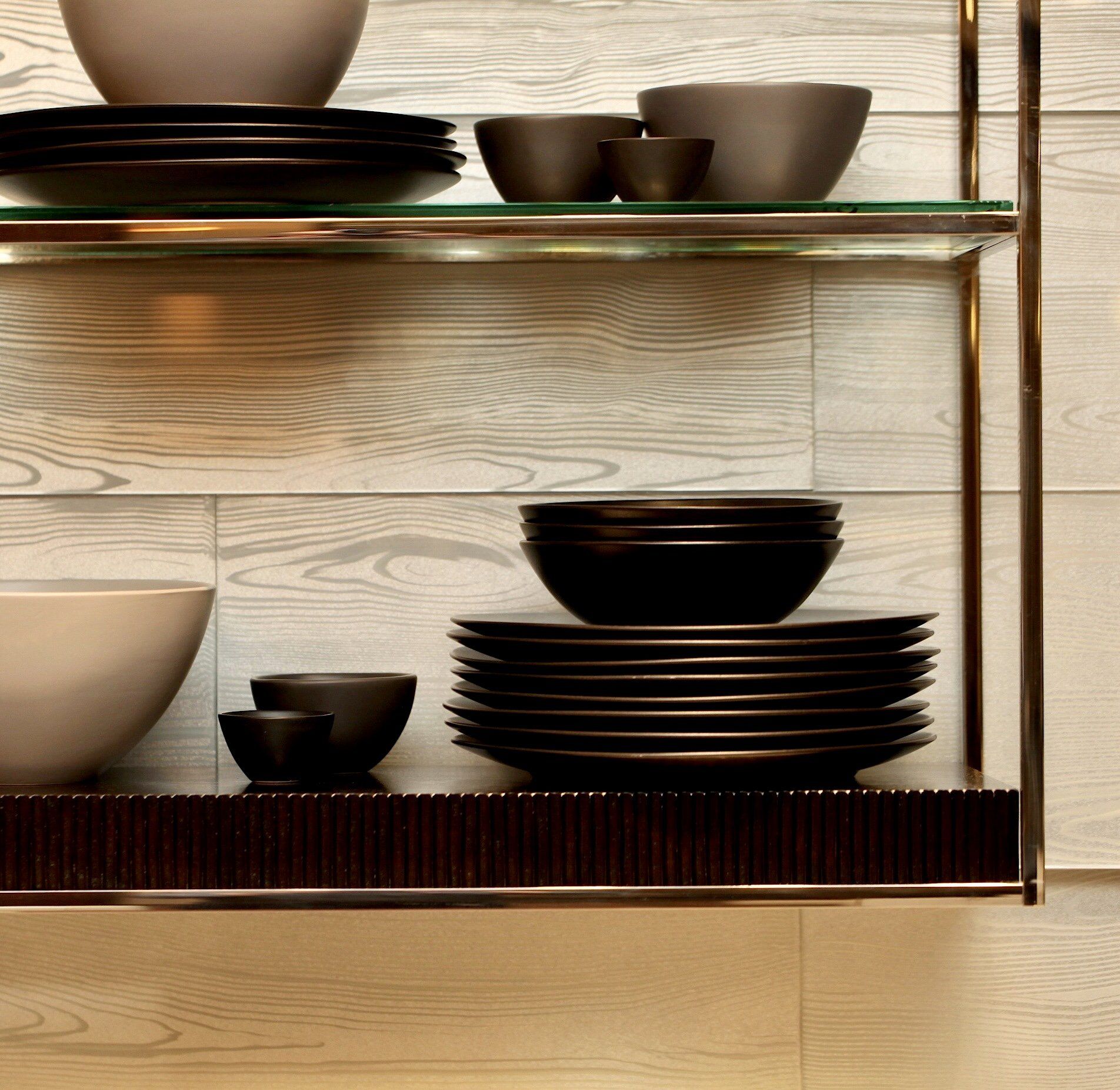 A shelf with bowls and plates on it