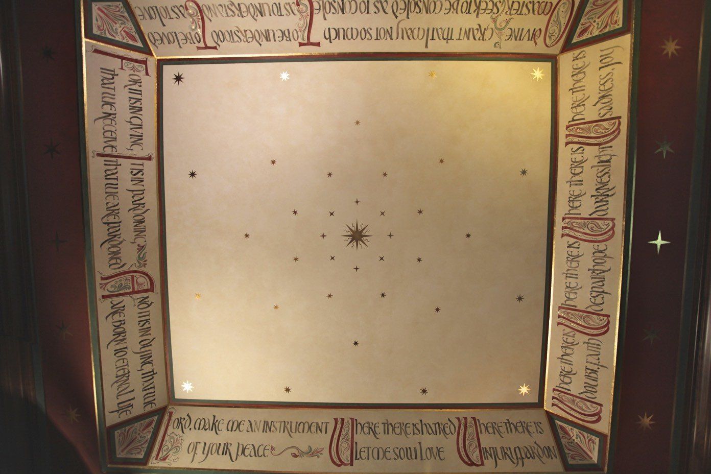 A ceiling with a star in the middle of it