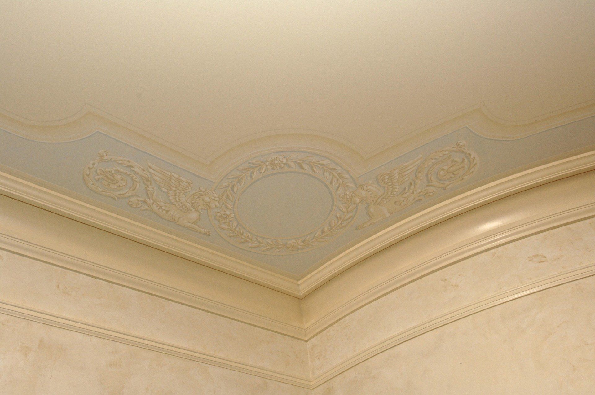 A close up of a ceiling with a molding on it.