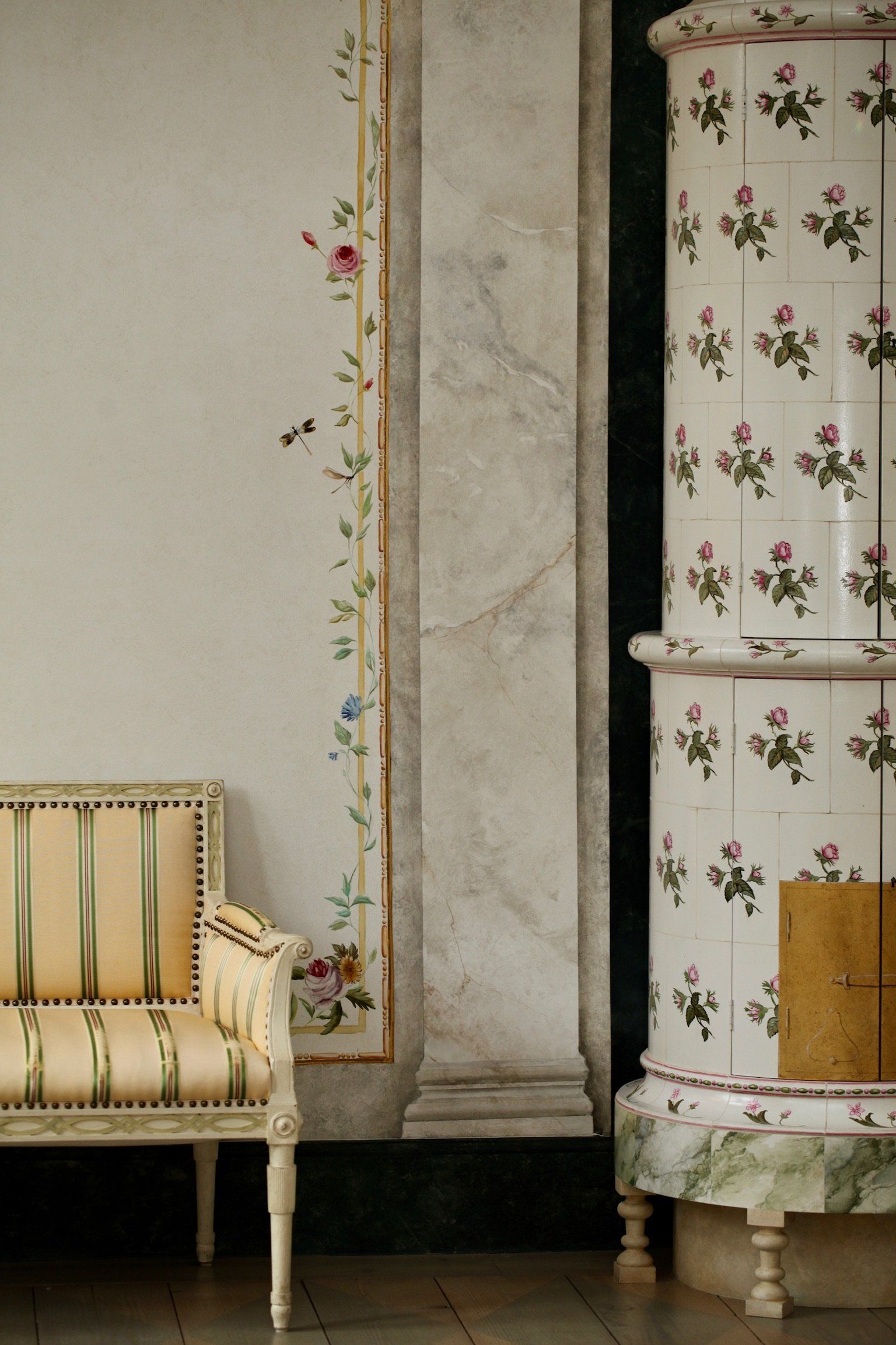 A chair and a stove with flowers on them