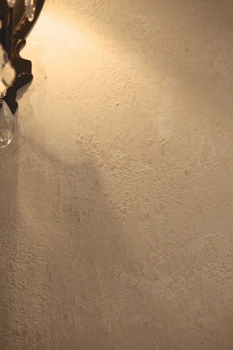 A close up of a carpeted floor with a light shining on it.