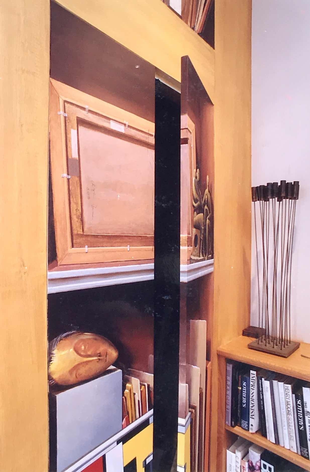 A picture of a bookshelf with a painting on it