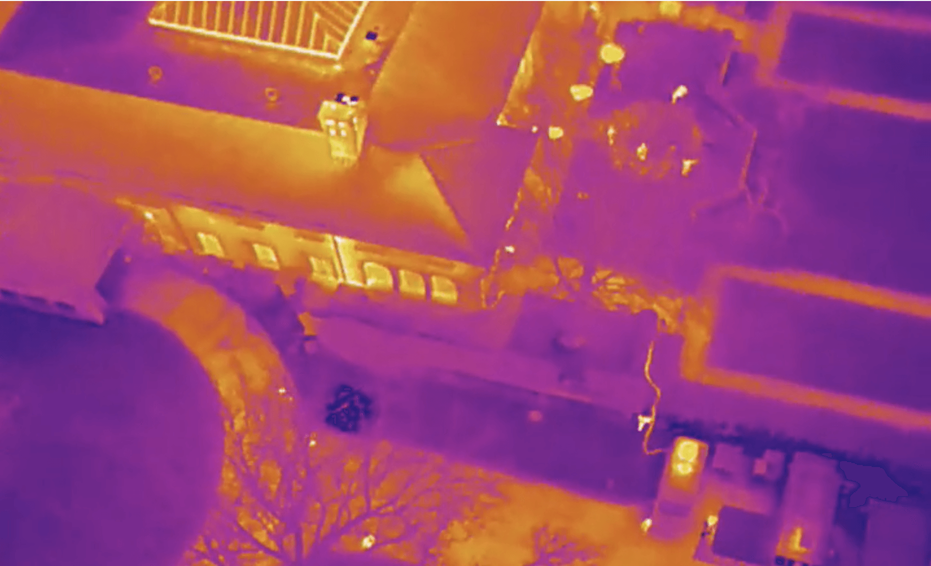 An aerial view of a house with a purple background.