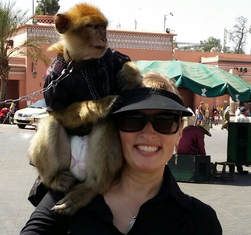Tamara with a  monkey on her shoulder
