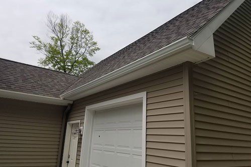 Suburban Home Featuring Seamless Gutters