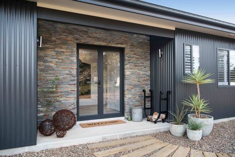 front door with plants outside