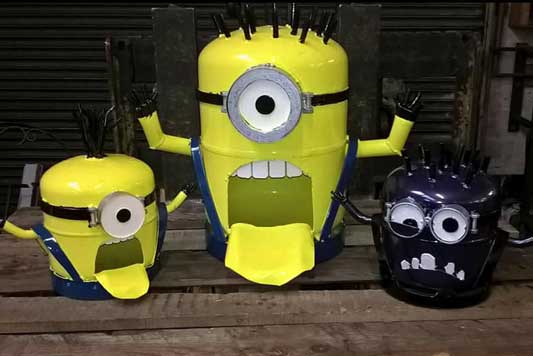 Dark blue and yellow minion log burners sat on wood table