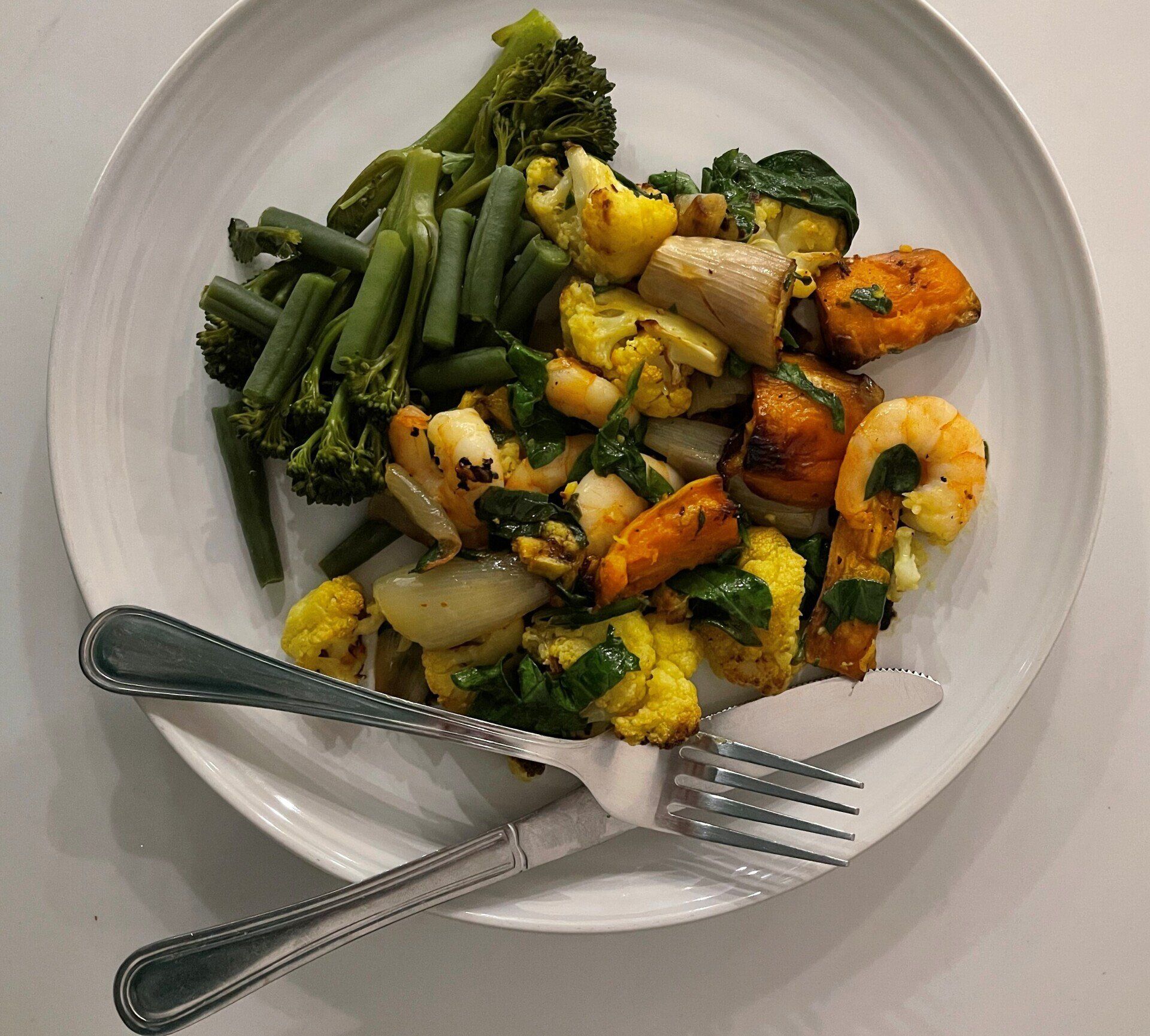 Spiced lime cauliflower with sweet spuds and king prawns
