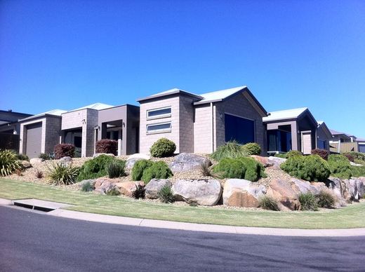 Metal roofed home metal roofed home with lanscaped yard