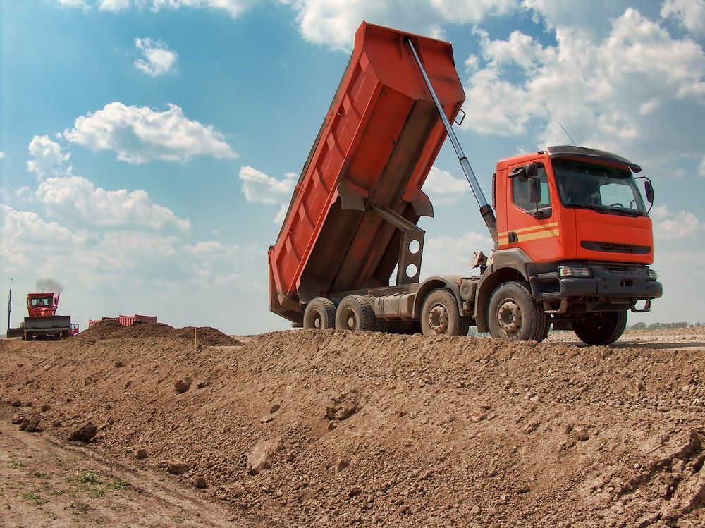 View of Dump Truck Dumping Earth — Greg Thompson Earthmoving in Pink Lily, QLD