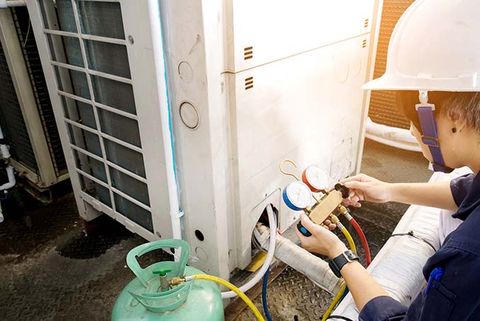 Commercial Hvac Unit — Technician Holding Manifold Gauge in Phoenix, AZ