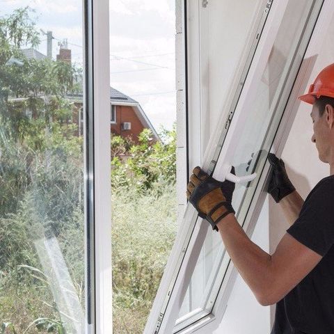 specialist repairing a upvc window