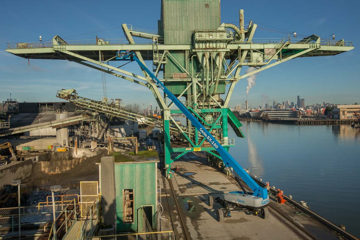 An aerial view of a large crane in a harbor.