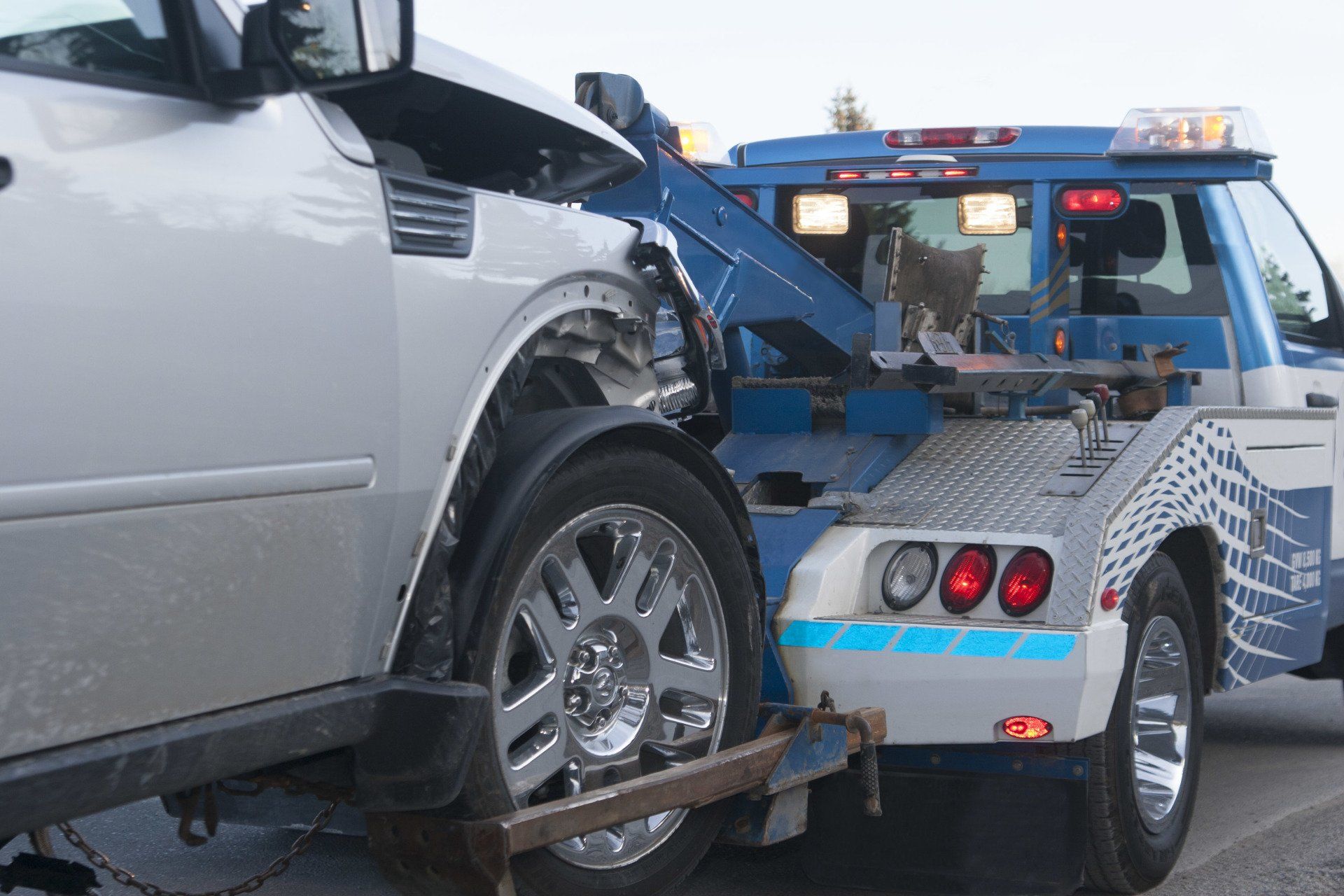 Truck Towing The Car — Kearny, NJ — Bibbs Auto Recycling