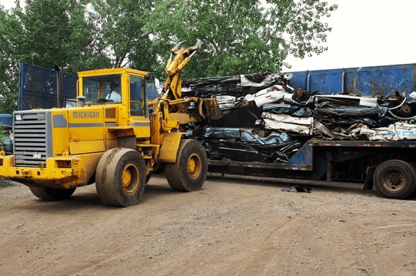 Placing The Crushed Car In Truck — Kearny, NJ — Bibbs Auto Recycling