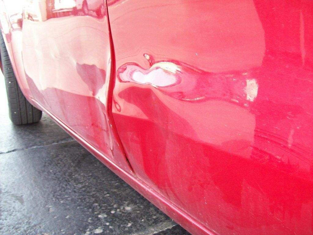 Kia Red Before — Oklahoma City, OK — Freeman Collision Center