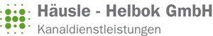 Ein Logo für die Häusle Helbok GmbH mit grünen Punkten