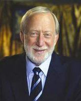 Dr. Stanley F. Malamed - Course Co-Director A man with a beard is wearing a suit and tie and smiling.