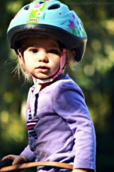Little girl in her horse riding lessons - horse riding in Olalla, WA Little girl in her horse riding lessons - horse riding in Olalla, WA