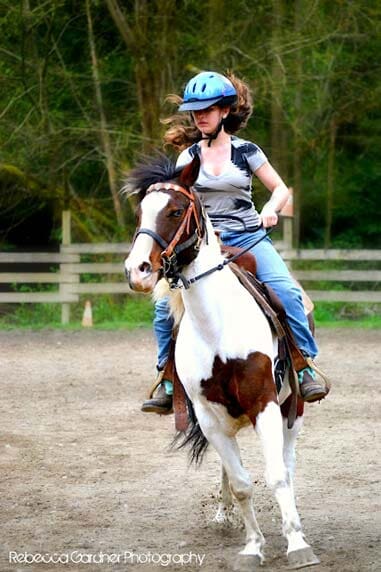 Woman riding horse - Horse riding lessons in Olalla WA Woman riding horse - Horse riding lessons in Olalla WA
