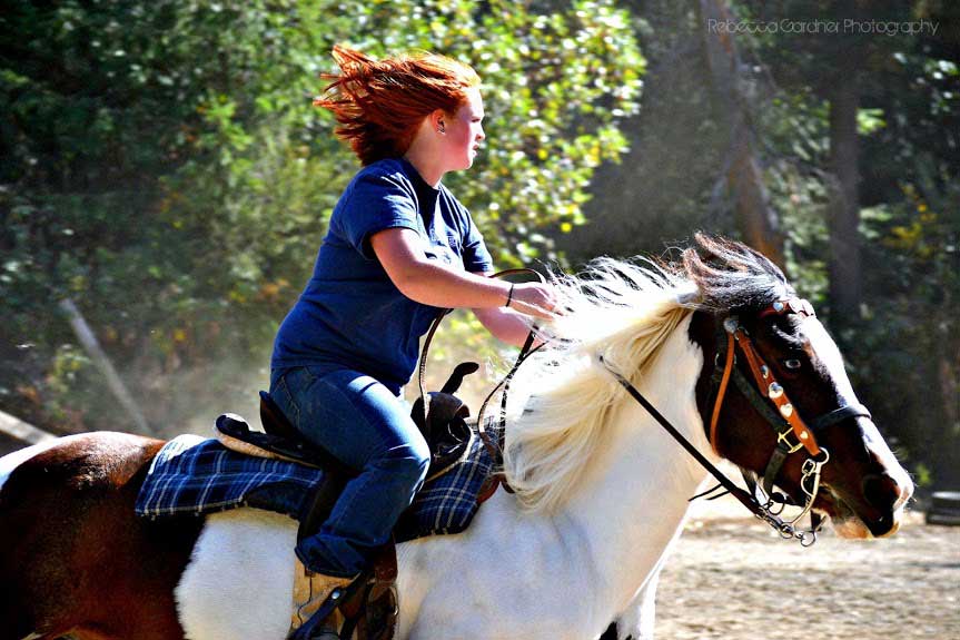 Woman riding horse - Horse riding lessons in Olalla WA Woman riding horse - Horse riding lessons in Olalla WA