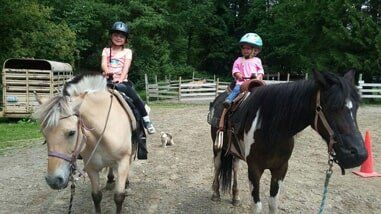 Two young girls on horses - Horse riding lessons in Olalla WA Two young girls on horses - Horse riding lessons in Olalla WA