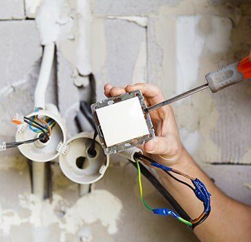 Electrician working - Electrical Repairs in Cook, MN Electrician working - Electrical Repairs in Cook, MN