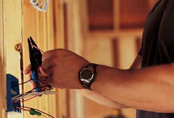 Electrician working - Electrical Repairs in Cook, MN Electrician working - Electrical Repairs in Cook, MN