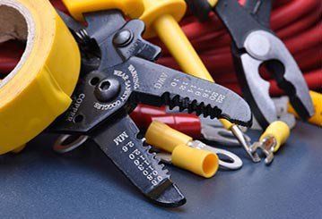 Tools for electrician and cables on metal surface - Electrical Repairs in Cook, MN Tools for electrician and cables on metal surface - Electrical Repairs in Cook, MN