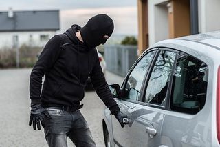 Car thief pulls the handle of a car. - truck accessory store in Valparaiso, IN Car thief pulls the handle of a car. - truck accessory store in Valparaiso, IN