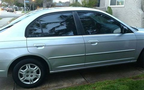 Silver Car With Tinted Window — Covina, California — Elite Tint Silver Car With Tinted Window — Covina, California — Elite Tint