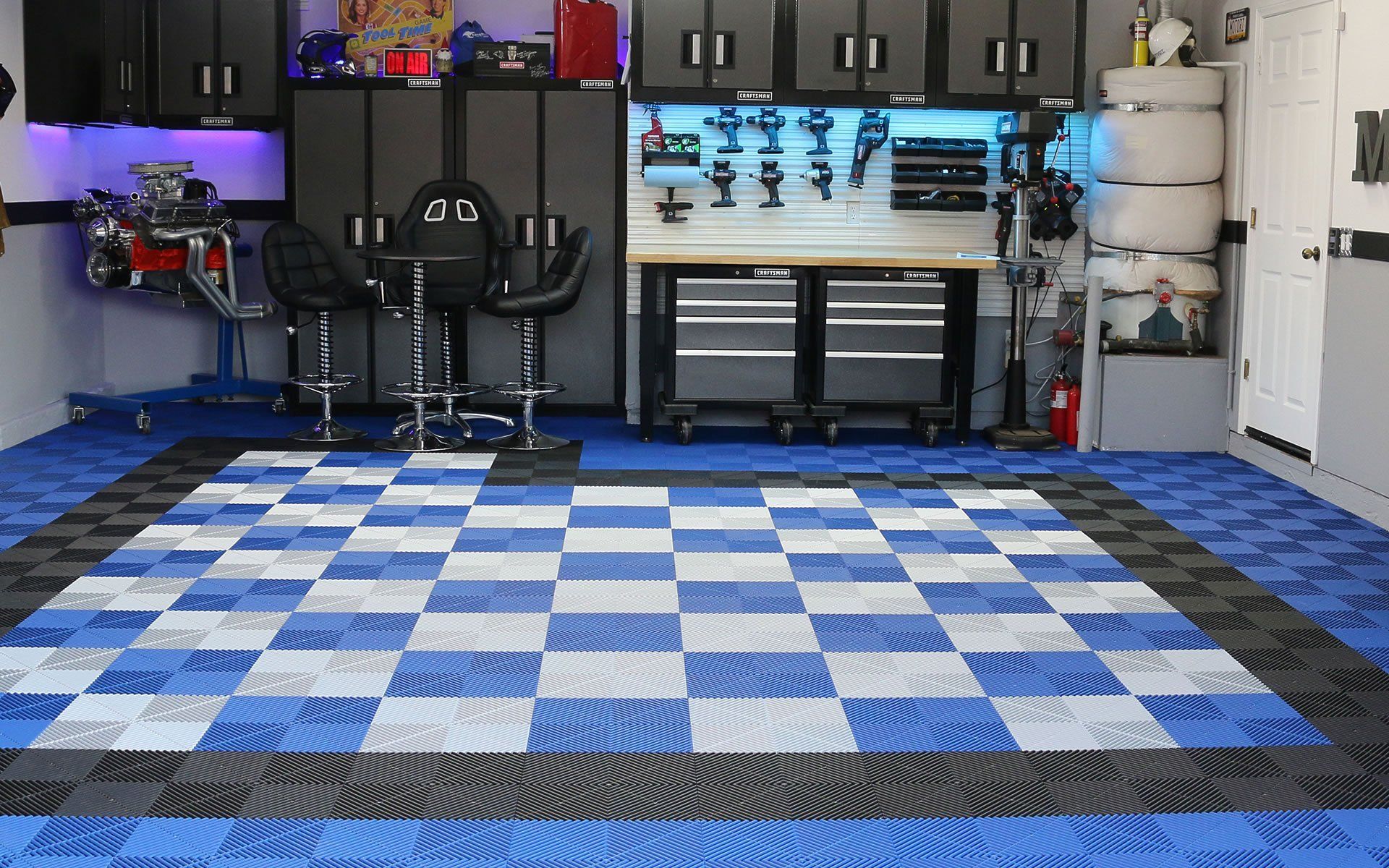 A garage with a blue and white checkered floor.