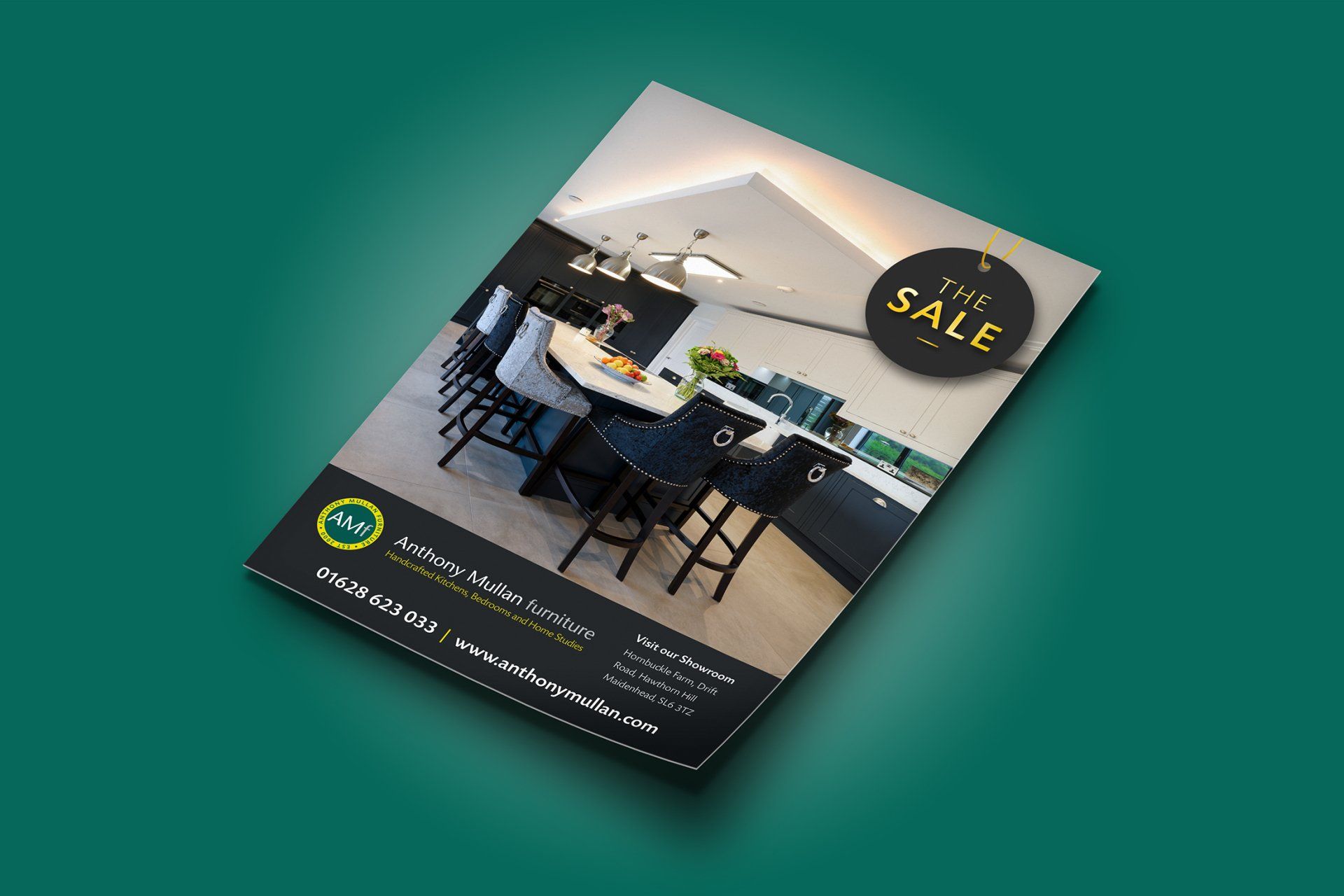 A brochure with a picture of a kitchen on it is on a green background.