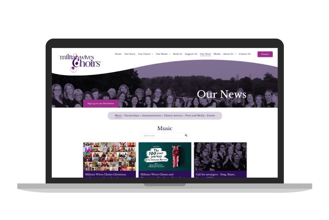 A laptop computer with a purple website on the screen.