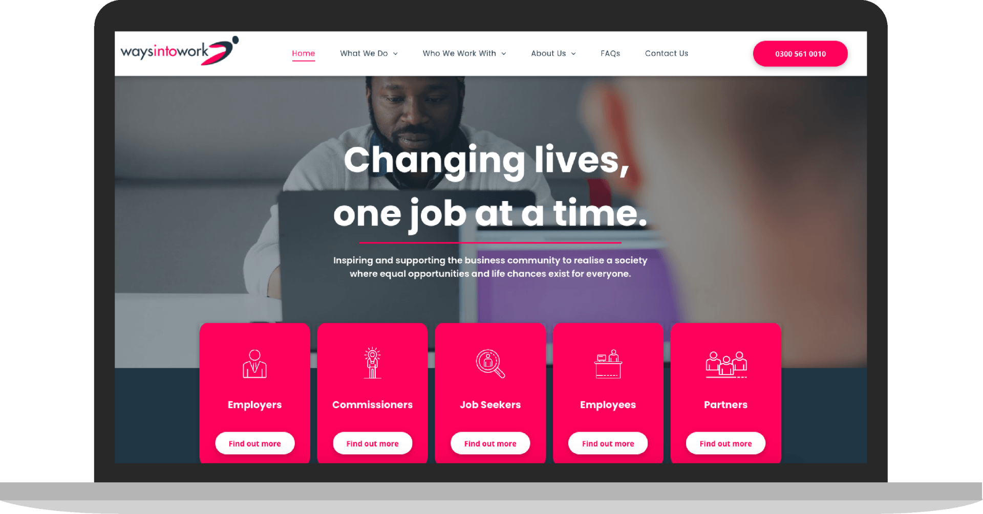 A laptop computer is open to a website that says `` changing lives , one job at a time . ''