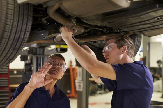 Auto Service — Technician Fixing Car in Waseca, MN Auto Service — Technician Fixing Car in Waseca, MN