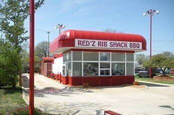 Red Z Rib Shack BBQ restaurant with red-and-white exterior and drive-through lane