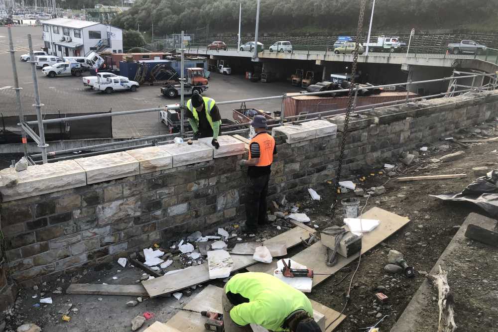 stone mason installing stone