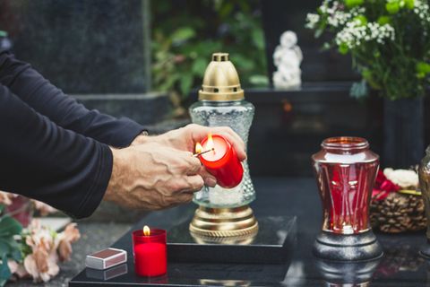 Lighting Candle at Graveyard — Billings, MT — Billings Monument Co.