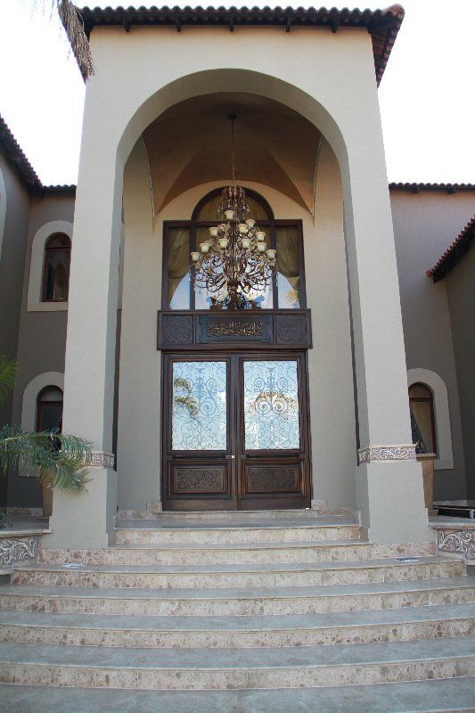 Grapedoor Custom made glass door with decorative steel