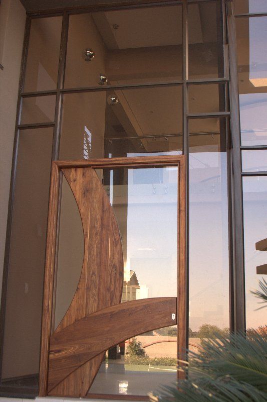 Grapedoor Custom made glass door with ornate wood design