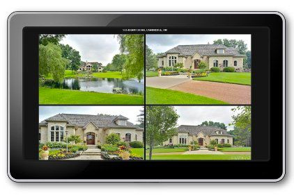 Tablet screen displaying a security camera feed of four different luxury homes.