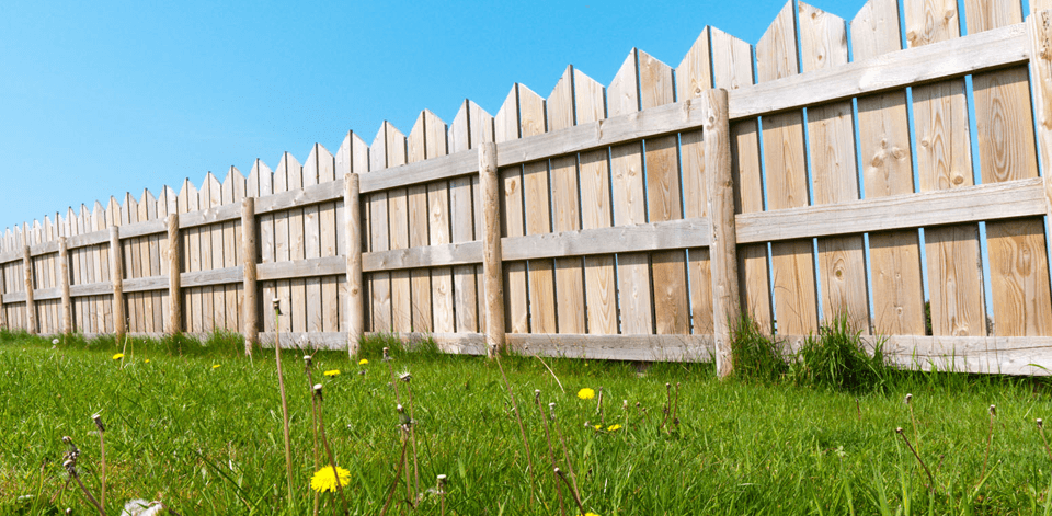A pointed wooden panel fence