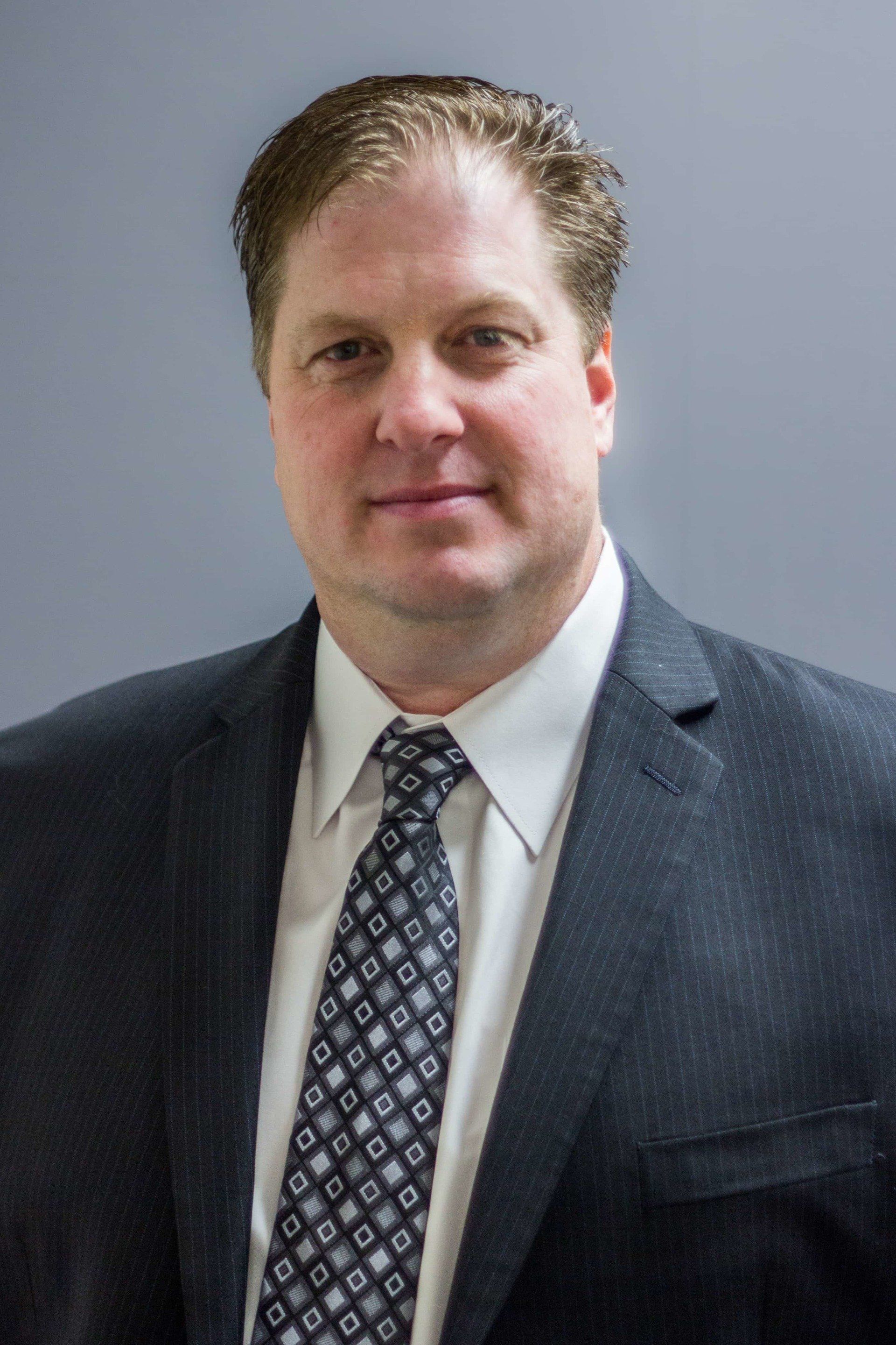 owner and operator DP Vending Phil Wilson wearing black coat with neck tie