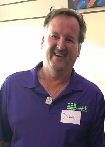 owner and operator DP Vending Dave Walls on purple DP Vending shirt
