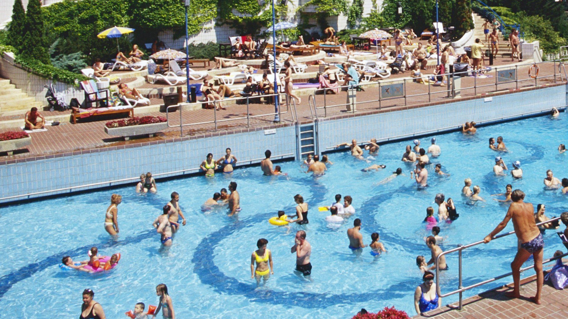 public pool with people swimming