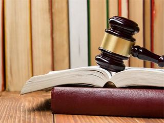 Law book with wooden judges gavel - General Law in Fort Wayne, IN Law book with wooden judges gavel - General Law in Fort Wayne, IN